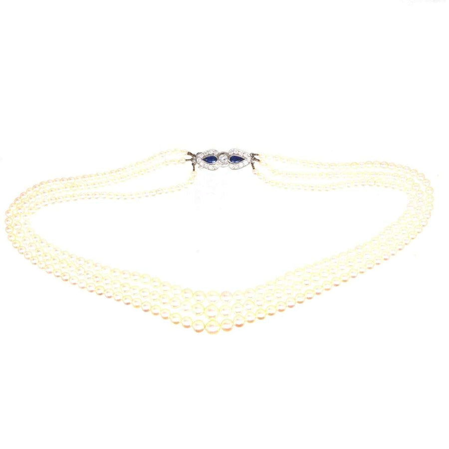 1940s cultured pearl triple strand necklace with sapphire and diamond clasp, elegant vintage jewelry.