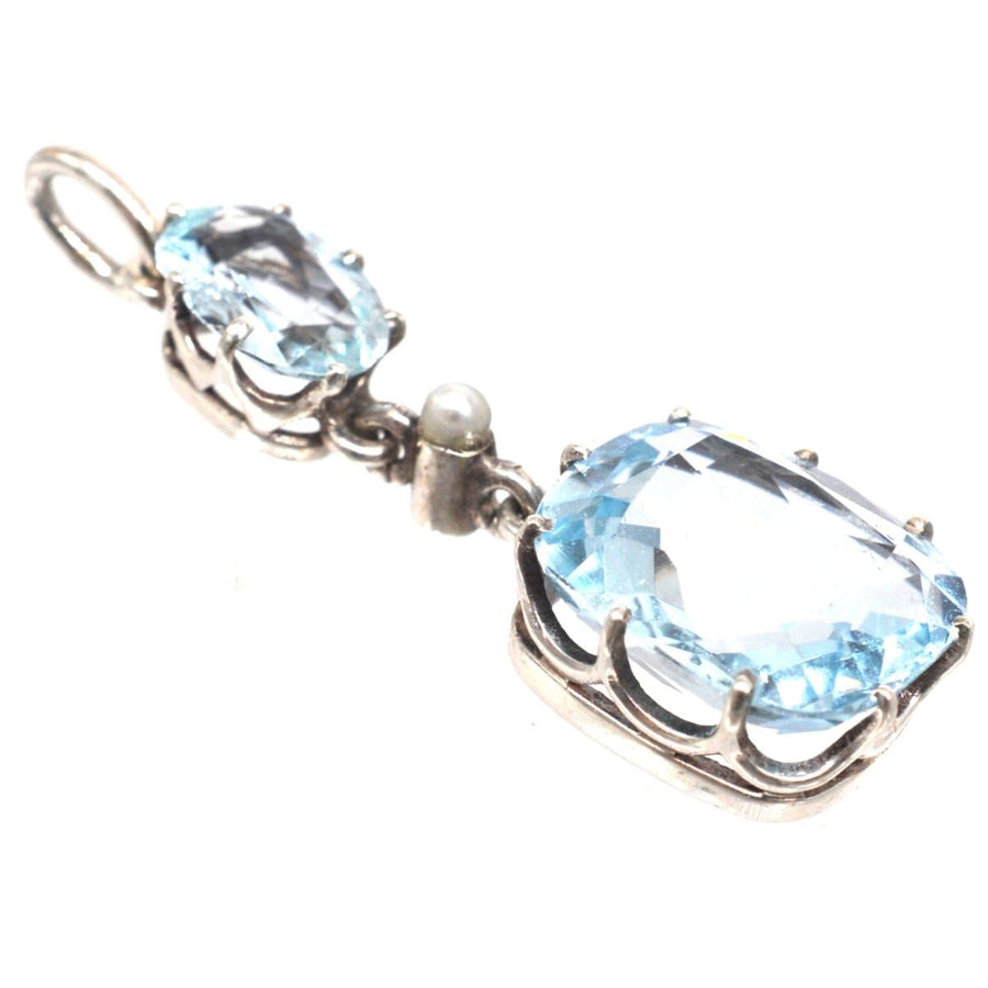 1940s platinum aquamarine and pearl drop pendant showcasing stunning blue stones.