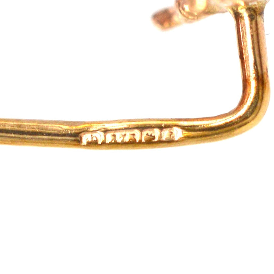Hallmark detail of a 1954 9ct gold running fox tie pin, showcasing fine craftsmanship and authenticity.
