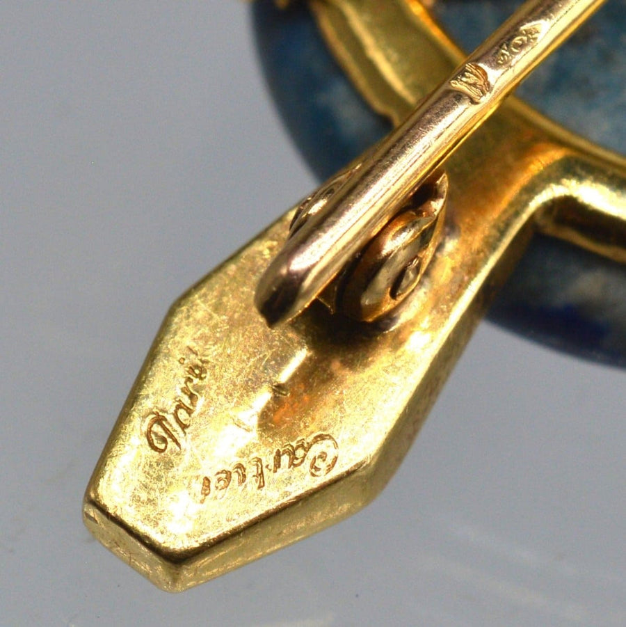 Close-up of signed Cartier Paris 18ct gold turtle brooch clasp, showcasing intricate design and craftsmanship.