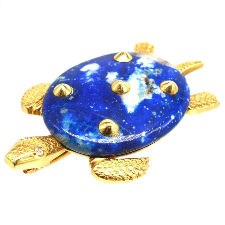 1950s Cartier Paris 18ct gold turtle brooch with lapis lazuli and diamond eyes, featuring five gold spikes.