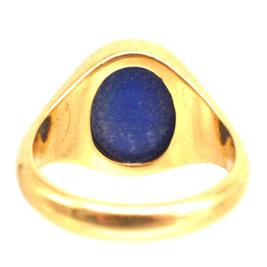 1960s 18ct gold signet ring featuring a blue lapis lazuli intaglio stone, showcasing a unique design.