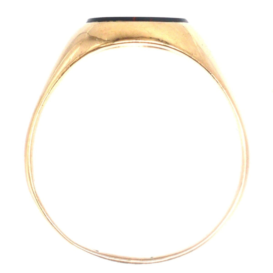 1960s 9ct gold signet ring featuring a deep bloodstone, showcasing stylish antique design and excellent condition.