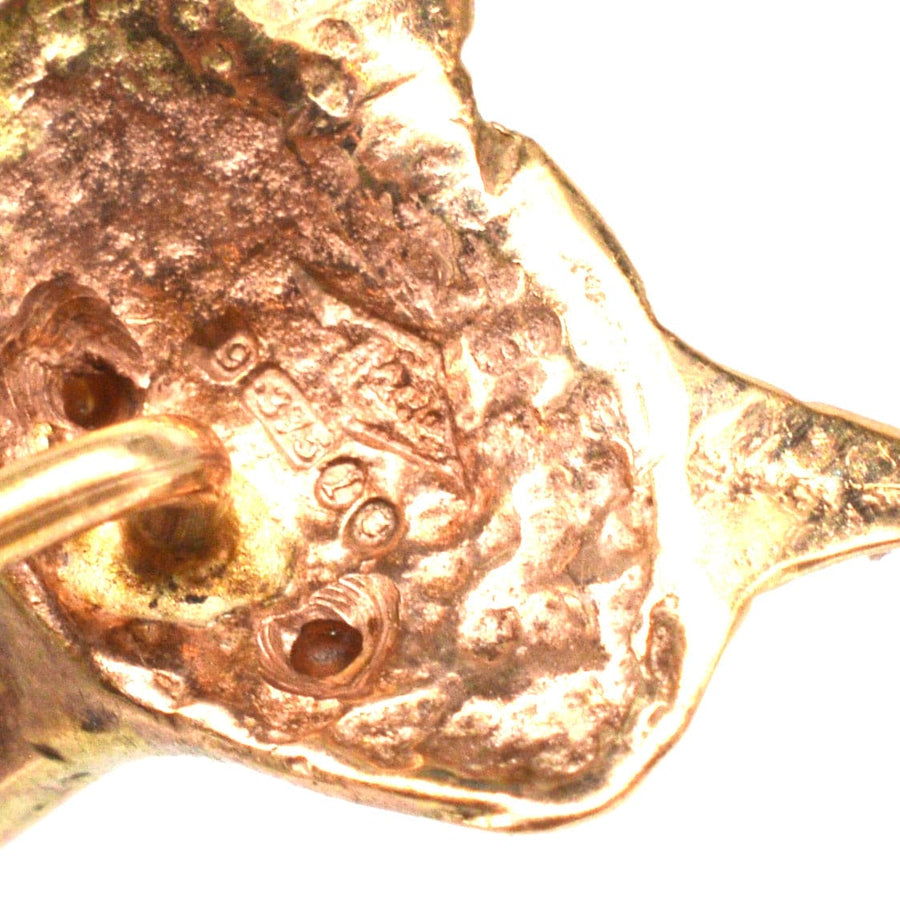 Hallmark detail of a 1960s 9ct gold fox head tie pin with garnet eyes, showcasing London 1966 certification.