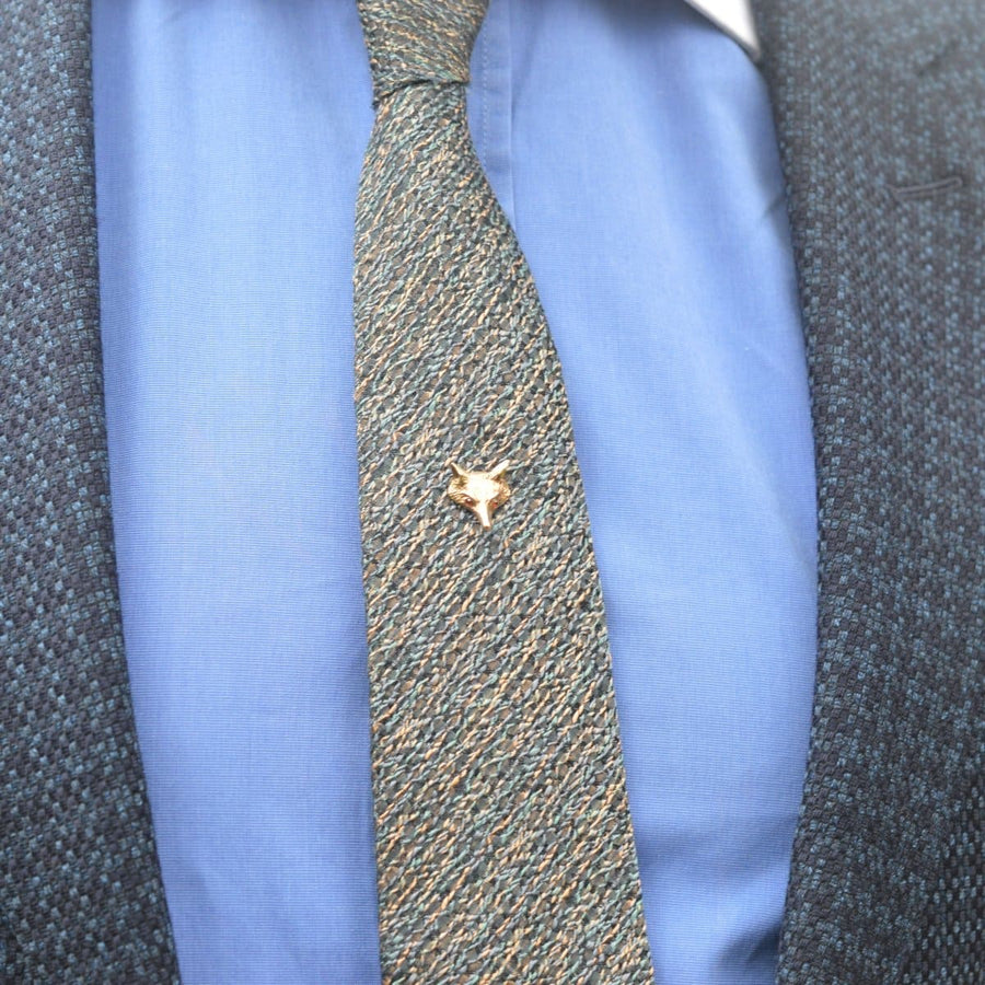 9ct gold fox tie pin with garnet eyes displayed on a textured tie and blue shirt, showcasing vintage 1966 London hallmark.