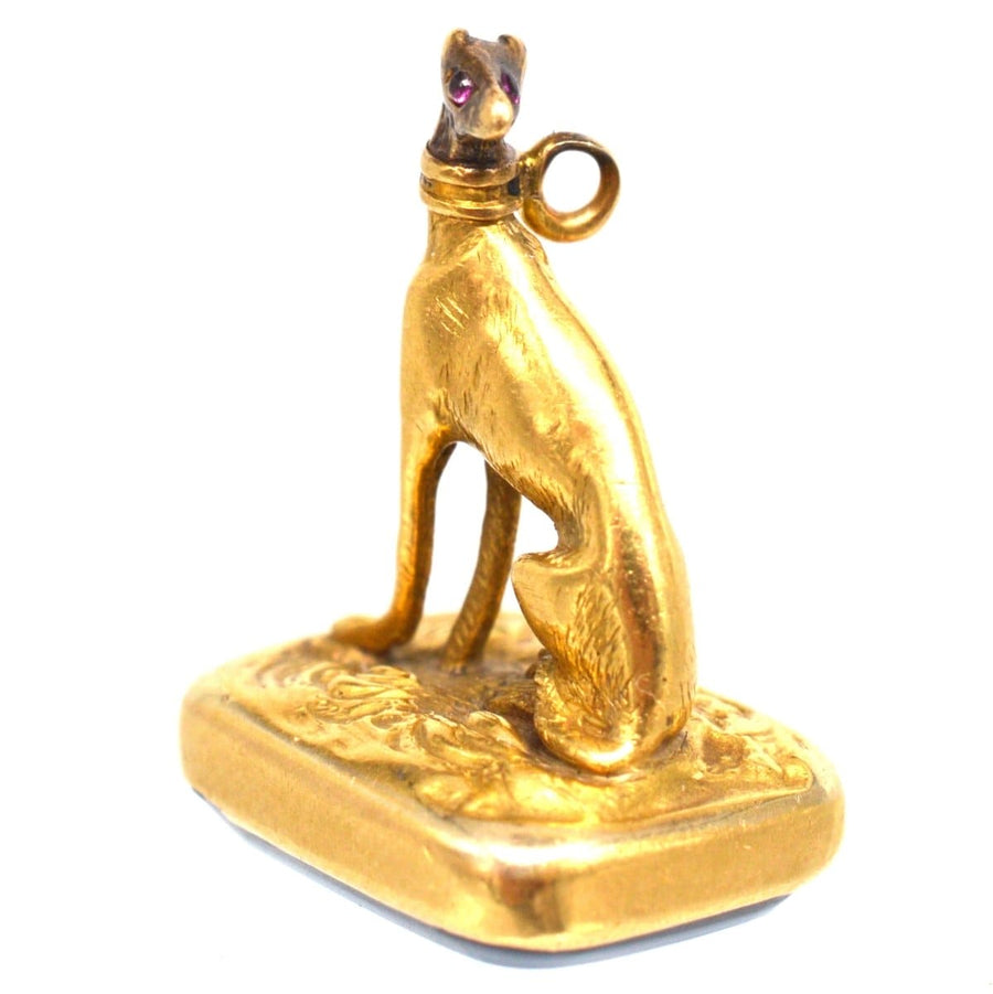 19th Century 15ct gold Whippet pendant with red stone eyes and sardonyx seal fob charm.