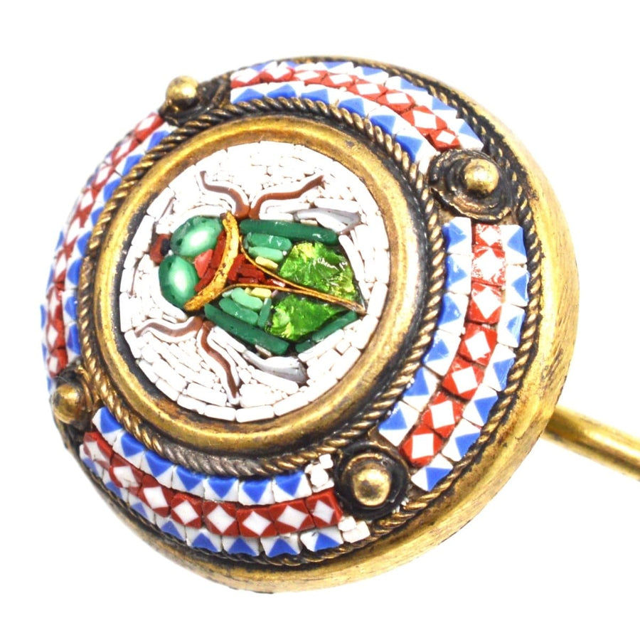 19th century Egyptian revival micromosaic tie pin featuring a scarab beetle with colorful iridescent details.