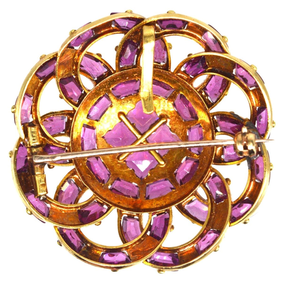 19th century French gold brooch featuring round rhodolite garnets in a flower design.