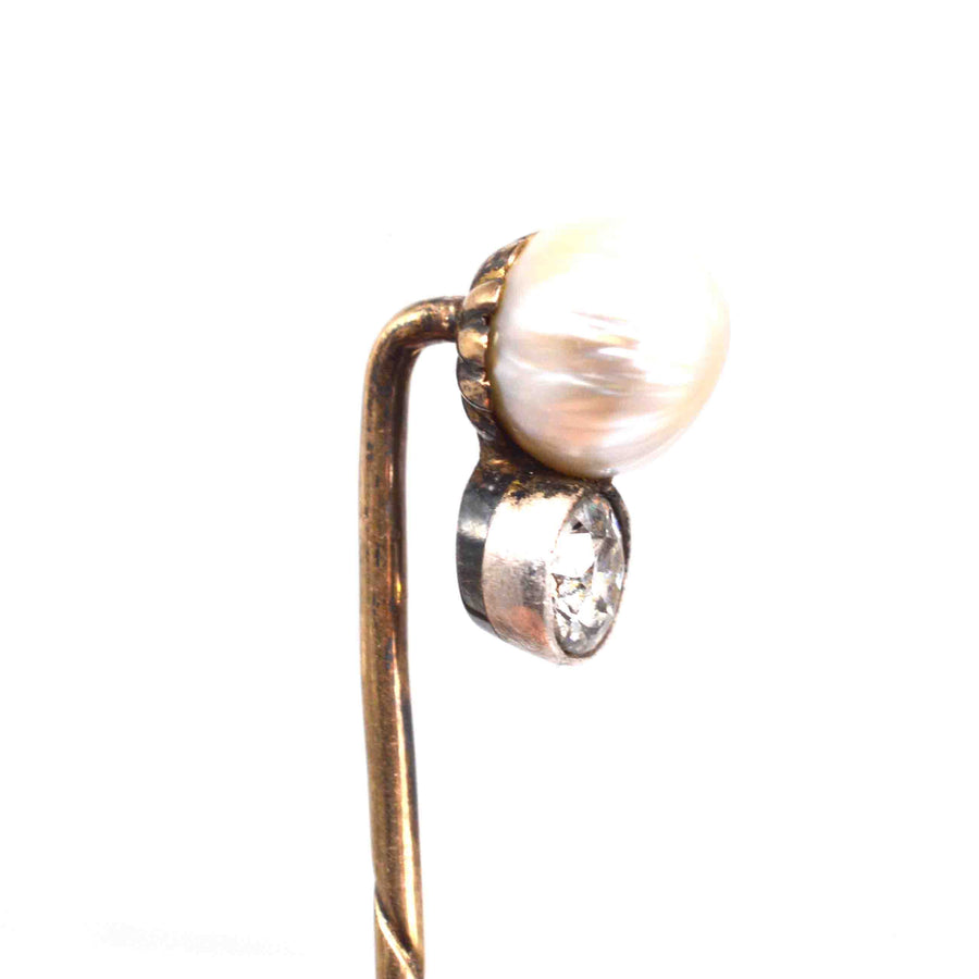 Edwardian 15ct gold tie pin featuring a natural pearl and half-carat diamond for elegant accessories.