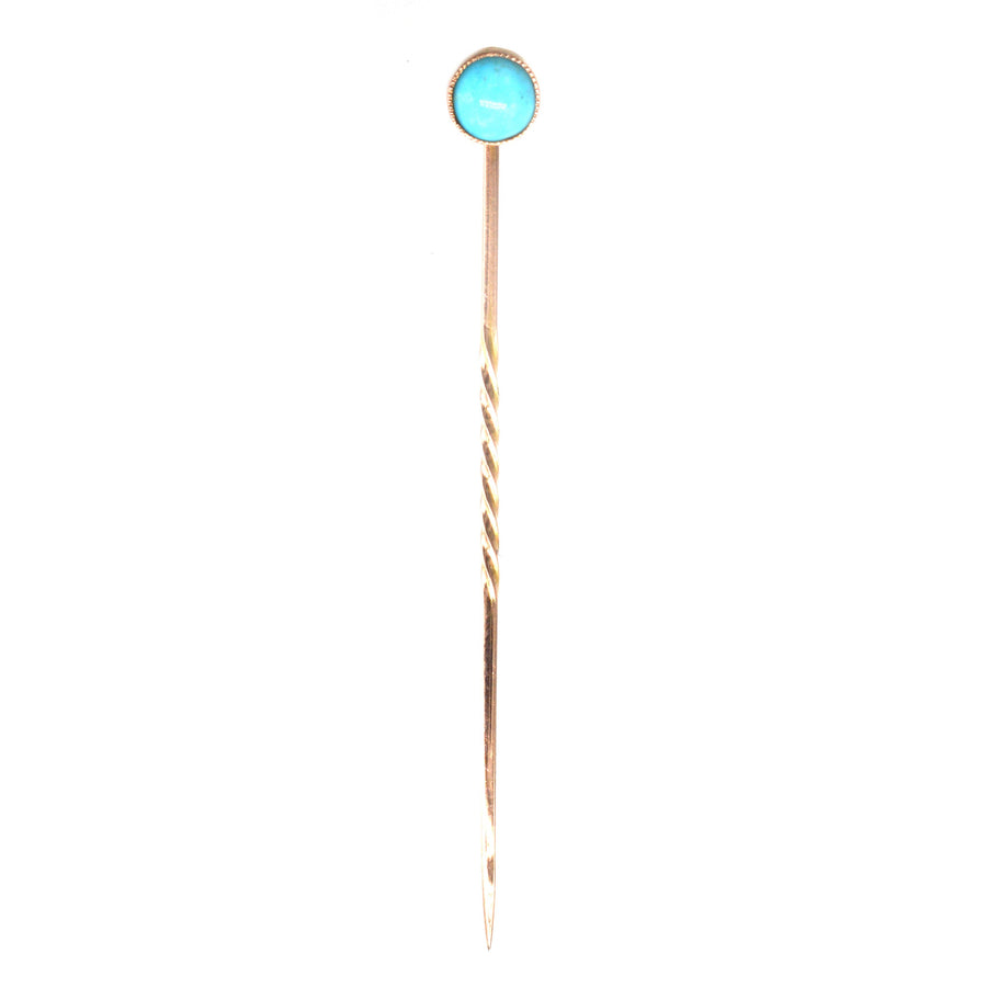 Edwardian 9ct gold tie pin featuring a vibrant turquoise stone in a classic millegrain setting.