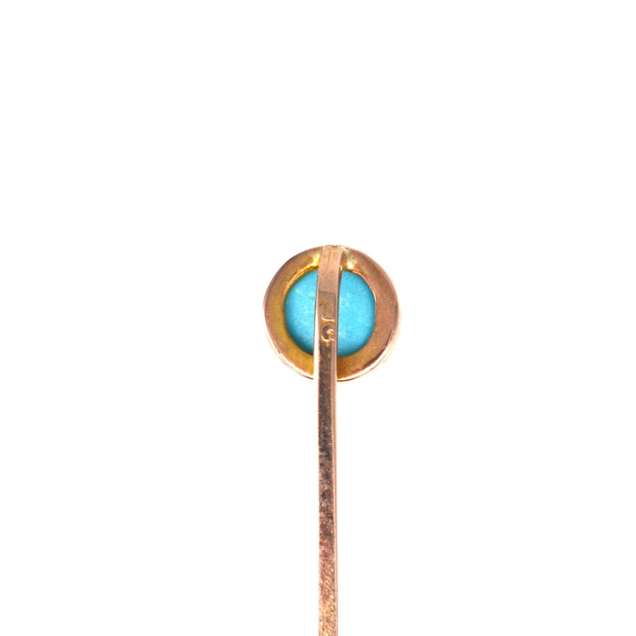 Edwardian 9ct gold tie pin featuring a vibrant turquoise stone in a classic millegrain setting.