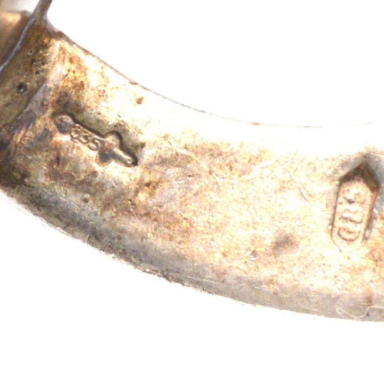 Close-up of hallmark on vintage silver cufflinks by G. J. Van Den Bergh Jr. from the Netherlands.