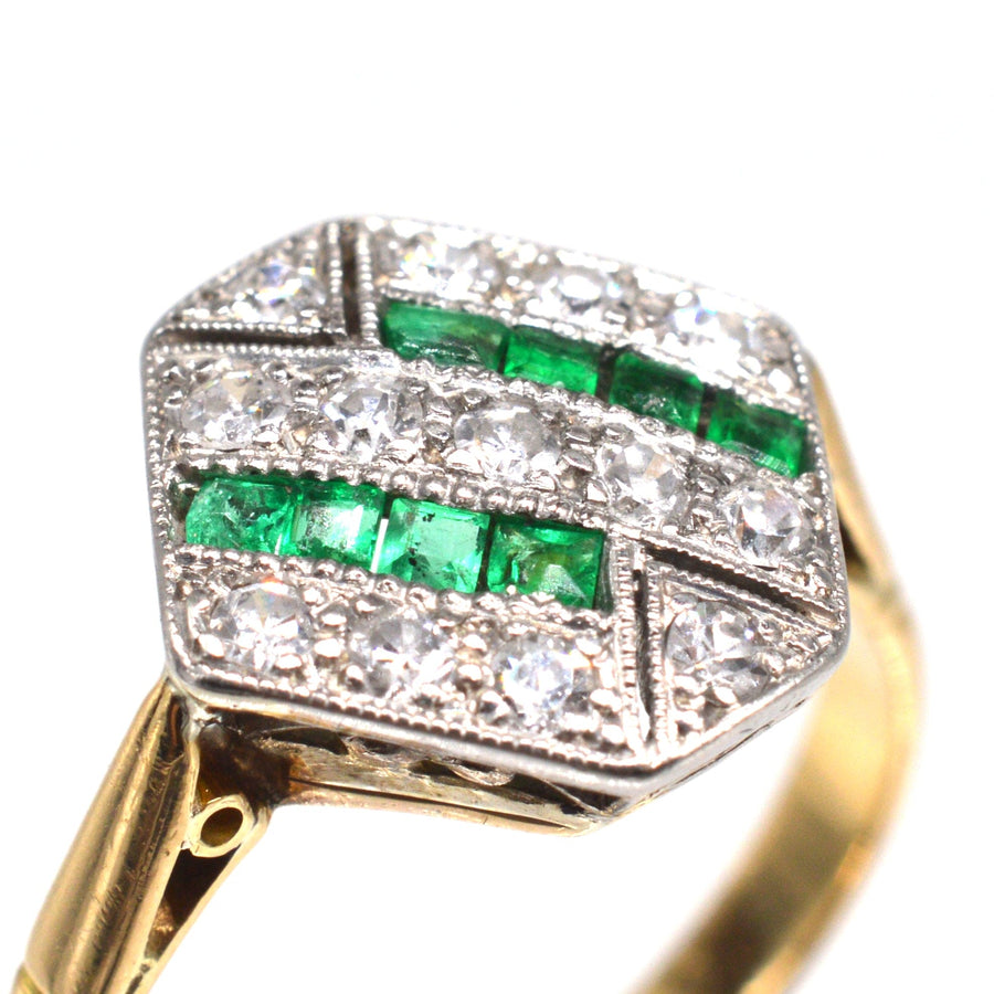 Art Deco 18ct gold and platinum ring featuring emeralds and diamonds in a hexagonal design.