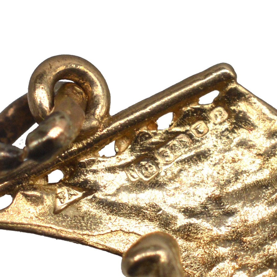 Close-up of Vintage 9ct Gold Vikings Ship Charm showing detailed craftsmanship and hallmark.