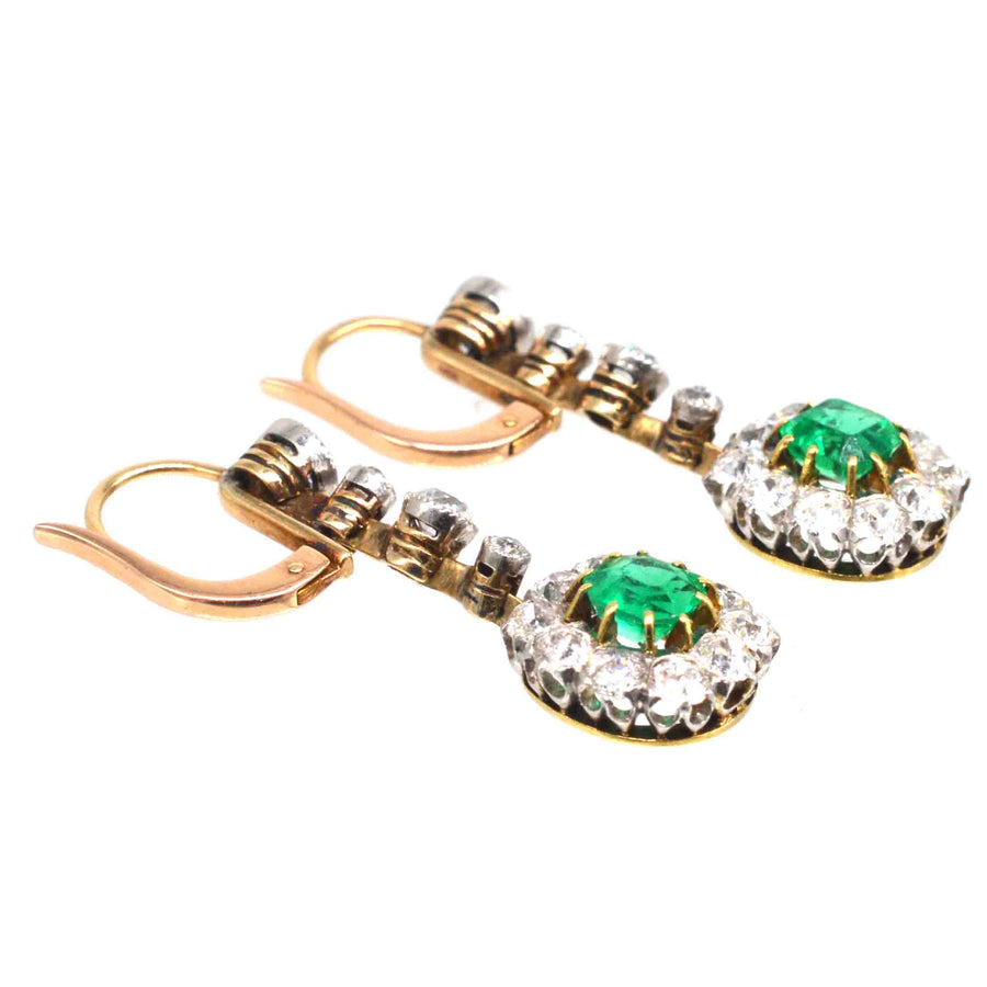 Edwardian emerald and diamond cluster drop earrings in gold and platinum setting, featuring Colombian emeralds.