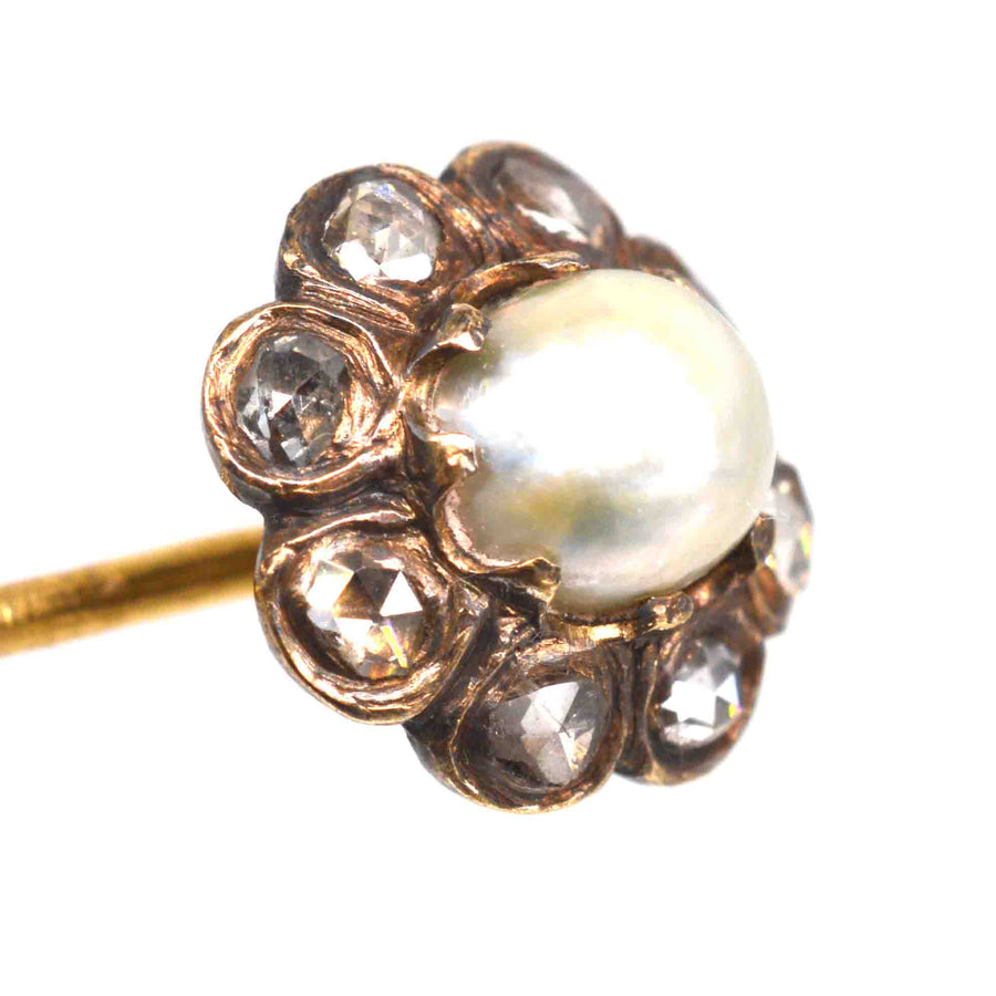 19th century gold tie pin featuring a natural pearl and rose cut diamonds in a cluster design.