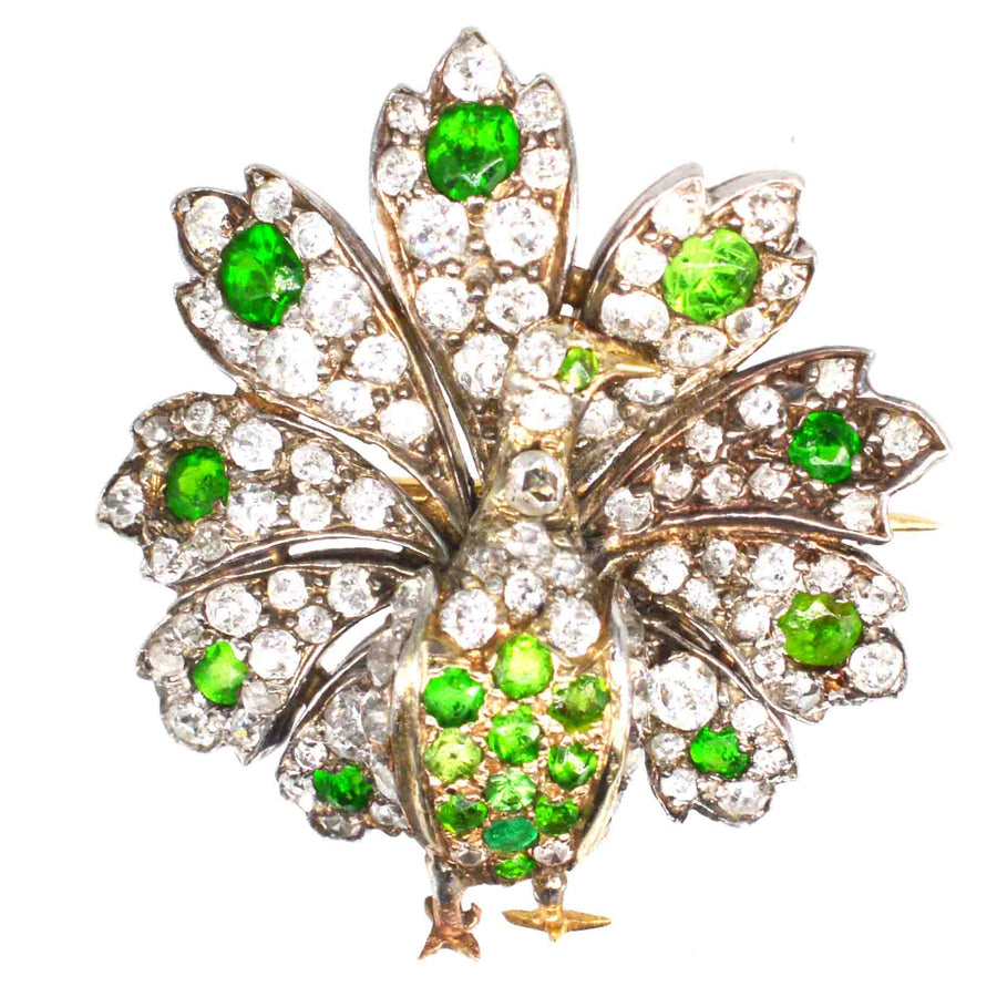 French Belle Epoque 18ct gold peacock brooch with green demantoid garnets and diamonds.