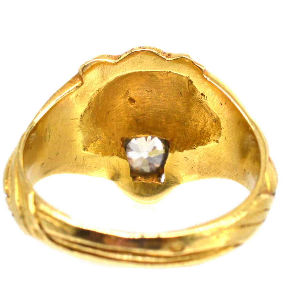 View of the interior of an 18ct gold lion’s head ring featuring a sparkling European old cut diamond.