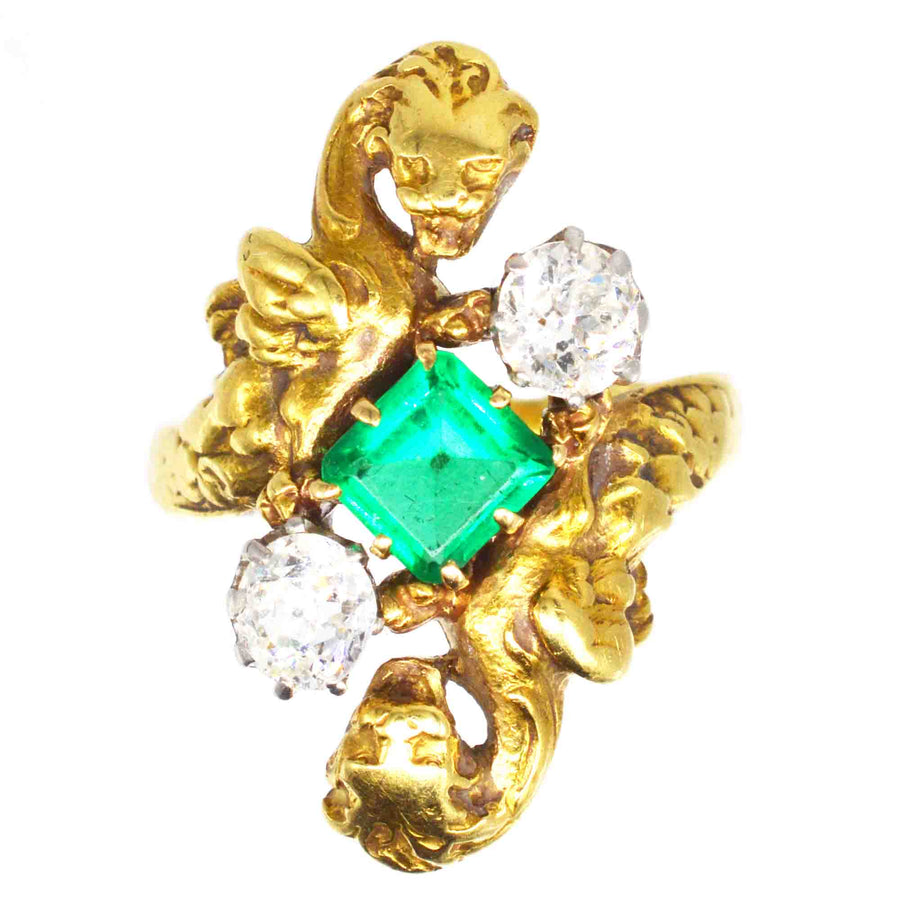 French Art Nouveau 18ct gold griffin ring featuring a Colombian emerald and two old European cut diamonds.