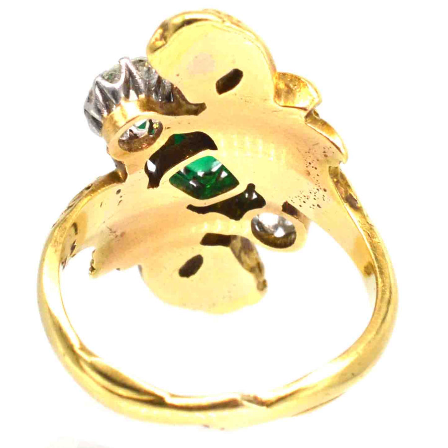 18ct gold Griffin ring featuring a Colombian emerald and diamonds, showcasing Art Nouveau craftsmanship.