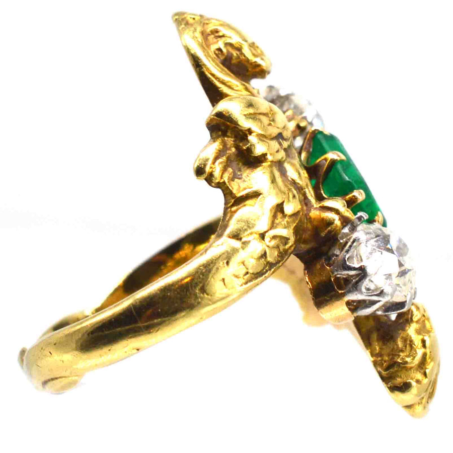 French Art Nouveau 18ct gold griffin ring featuring a Colombian emerald and two old European cut diamonds.