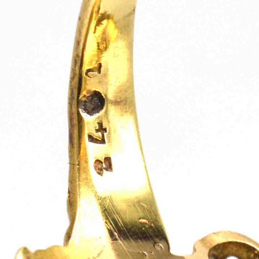 Close-up of the inner hallmark and engraving of an 18ct gold ring, showcasing authenticity and craftsmanship.