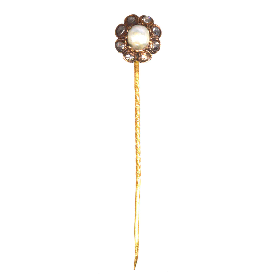 19th Century 18ct gold cluster tie pin featuring a natural pearl and rose cut diamonds in a floral design.