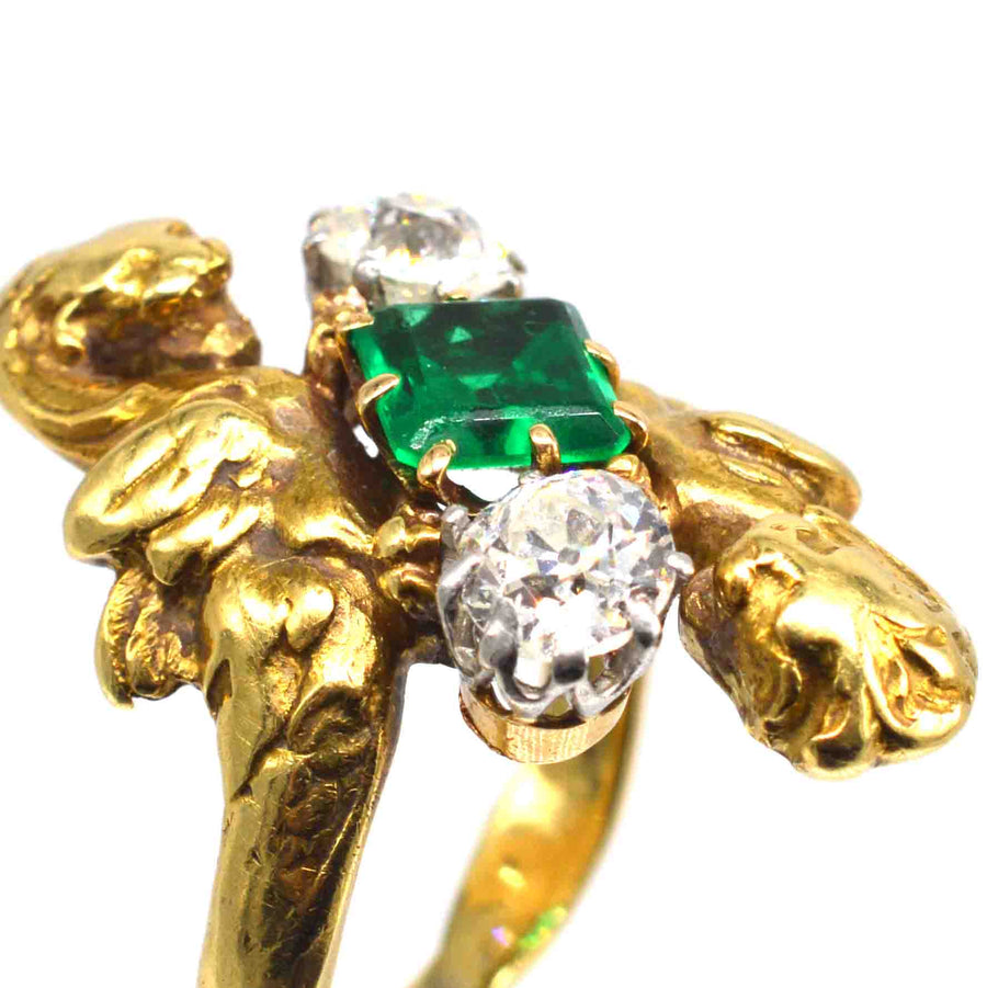 French Art Nouveau 18ct gold griffin ring with Colombian emerald and diamonds, showcasing intricate design and gemstones.