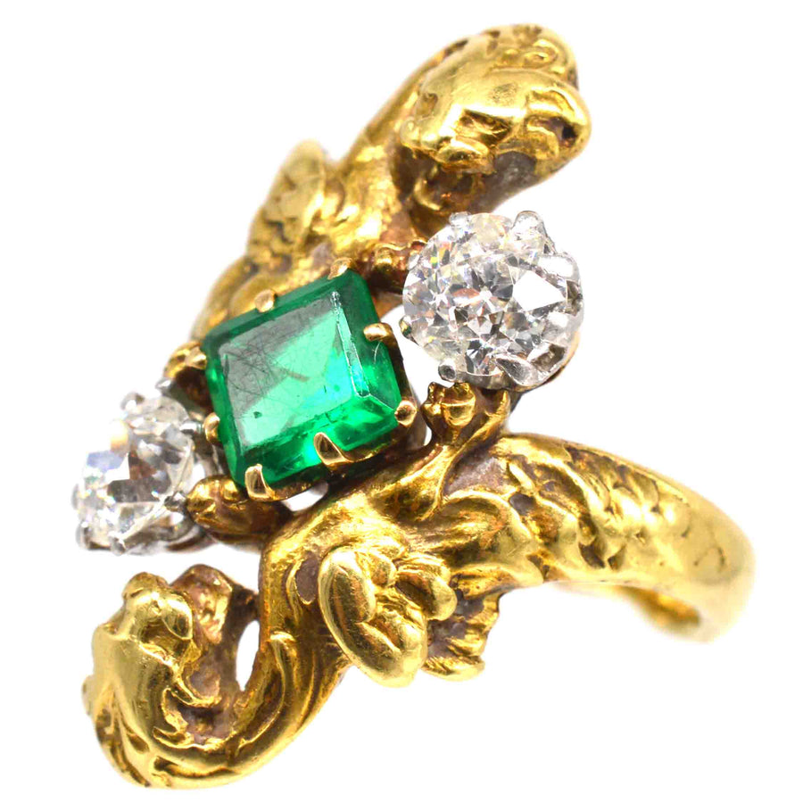 French Art Nouveau 18ct gold griffin ring featuring a Colombian emerald and two old European cut diamonds.