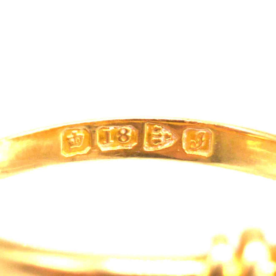 Close-up of 18ct gold hallmark and assay marks on the interior of the Edwardian snake ring.