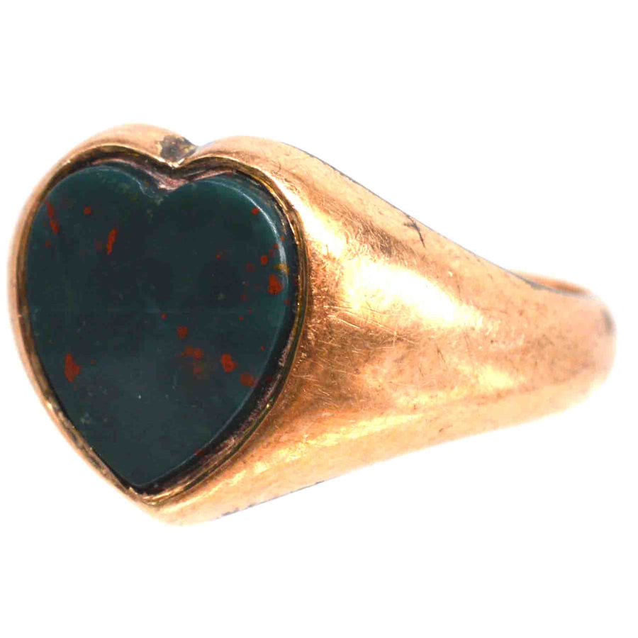 Edwardian 9ct gold signet ring with heart-shaped bloodstone, showcasing timeless craftsmanship and unique charm.