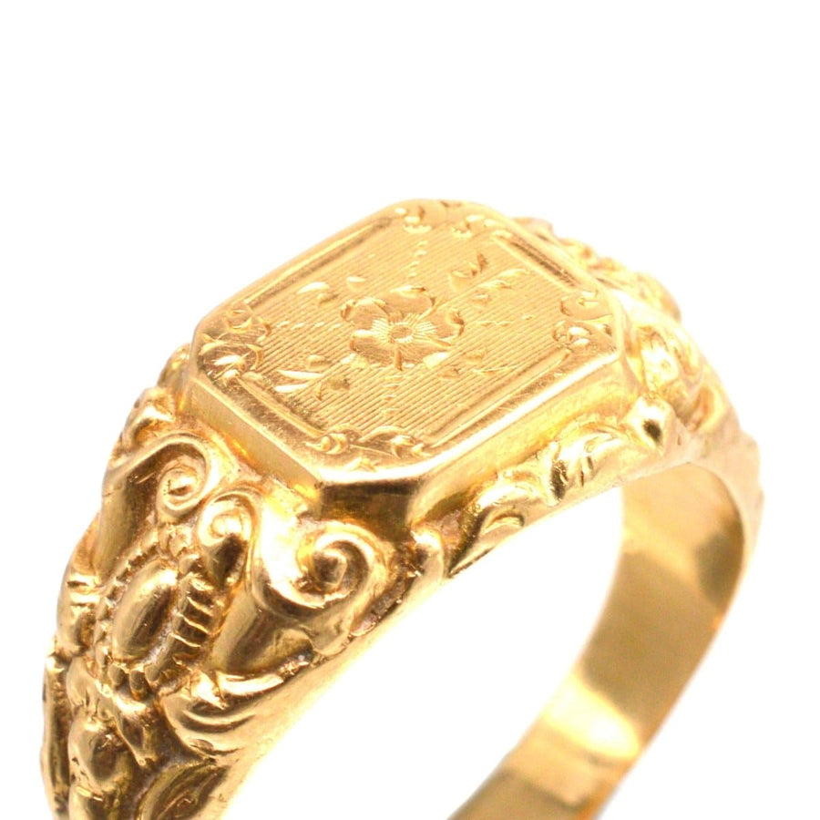 Antique French 18ct gold ring with engraved rose details and ornate shoulders.