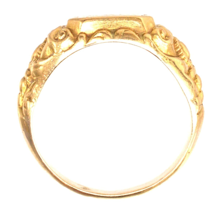Antique French 18ct gold ring featuring carved rose details and beautifully swirled shoulders.