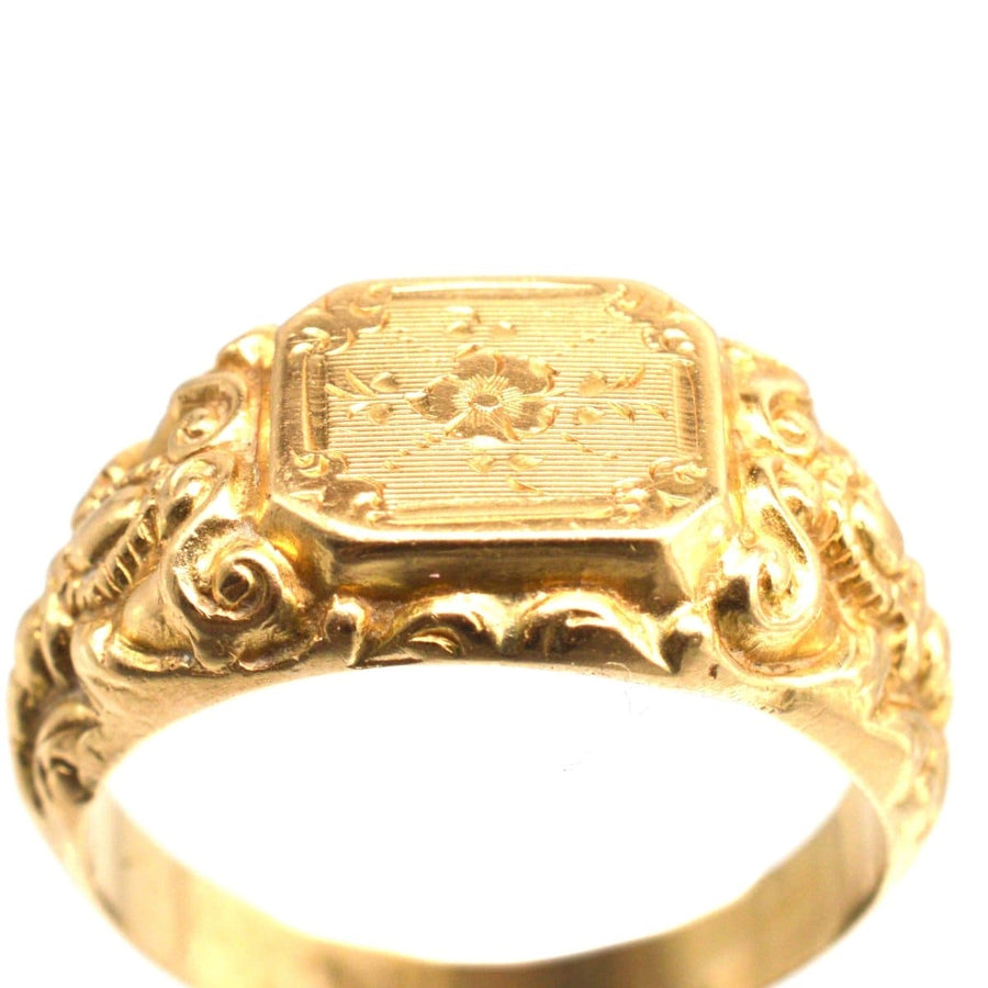 Antique French 18ct gold ring featuring rose engravings and intricate swirls, showcasing a lovely buttery hue.