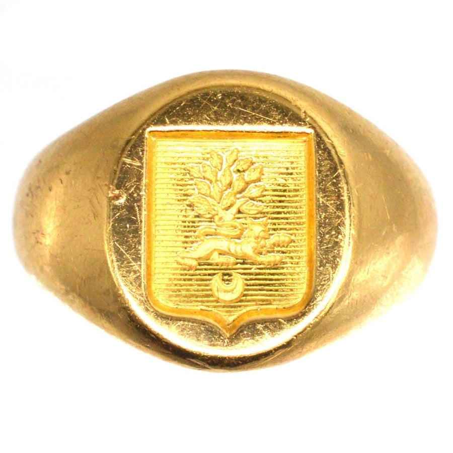 Antique French 18ct gold signet ring with hand-engraved armorial shield featuring a lion and tree.