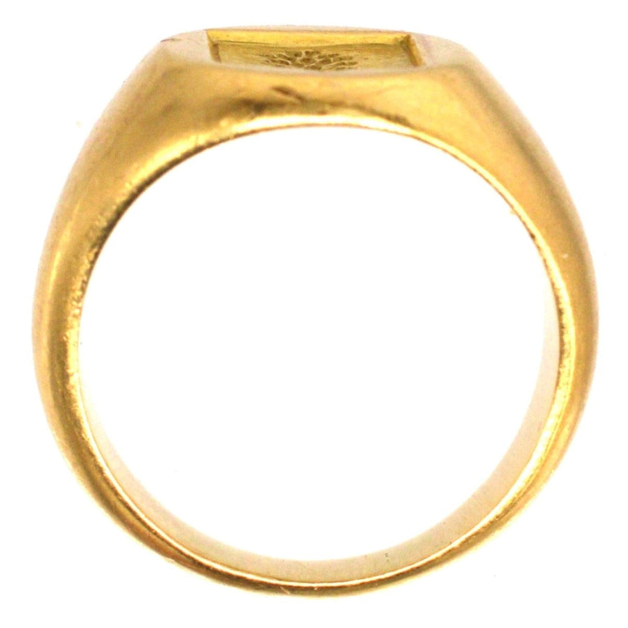 Antique French 18ct gold signet ring featuring a hand-engraved armorial shield design.
