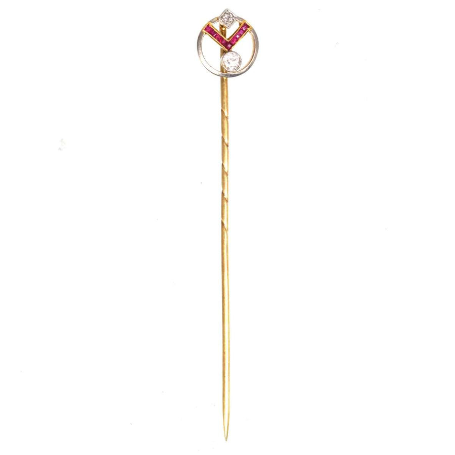 Art Deco 14ct gold pin featuring rubies and diamonds in a geometric design, embodying vintage glamour.