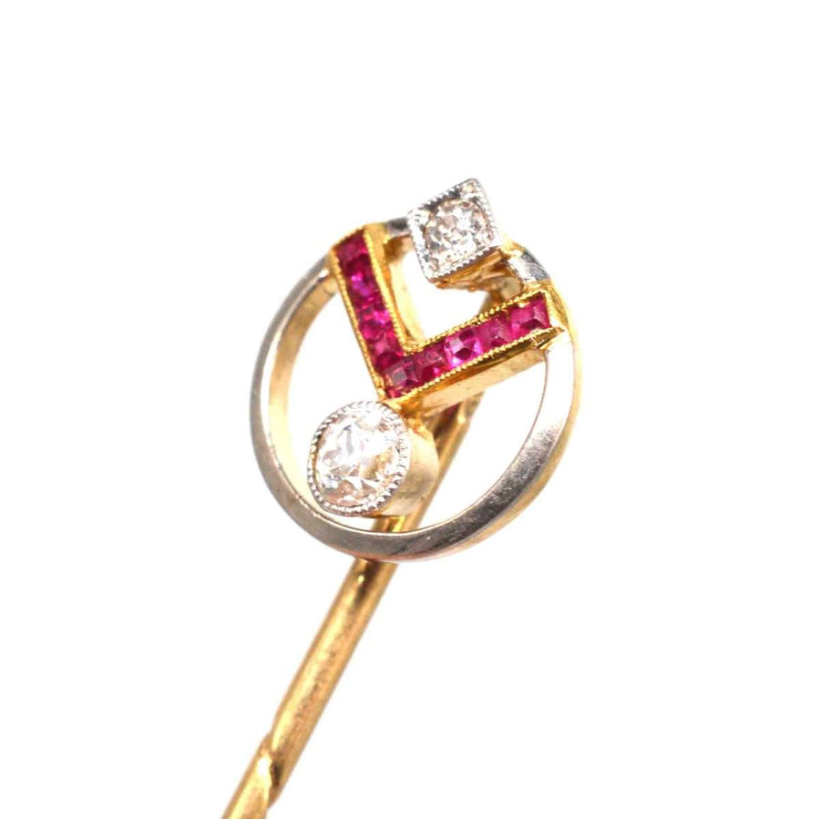 Art Deco 14ct gold geometric pin featuring rubies and diamonds, embodying vintage glamour from the 1920s.