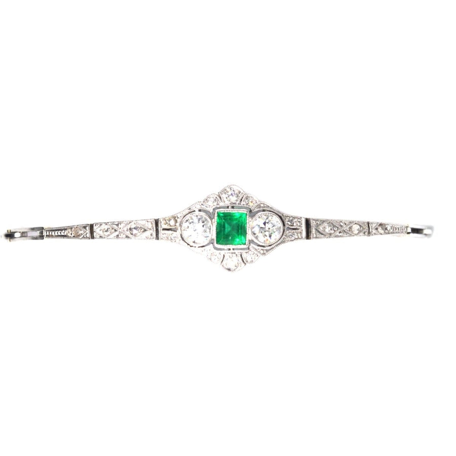 Art Deco 14ct white gold bracelet featuring square-cut emerald and two European cut diamonds.