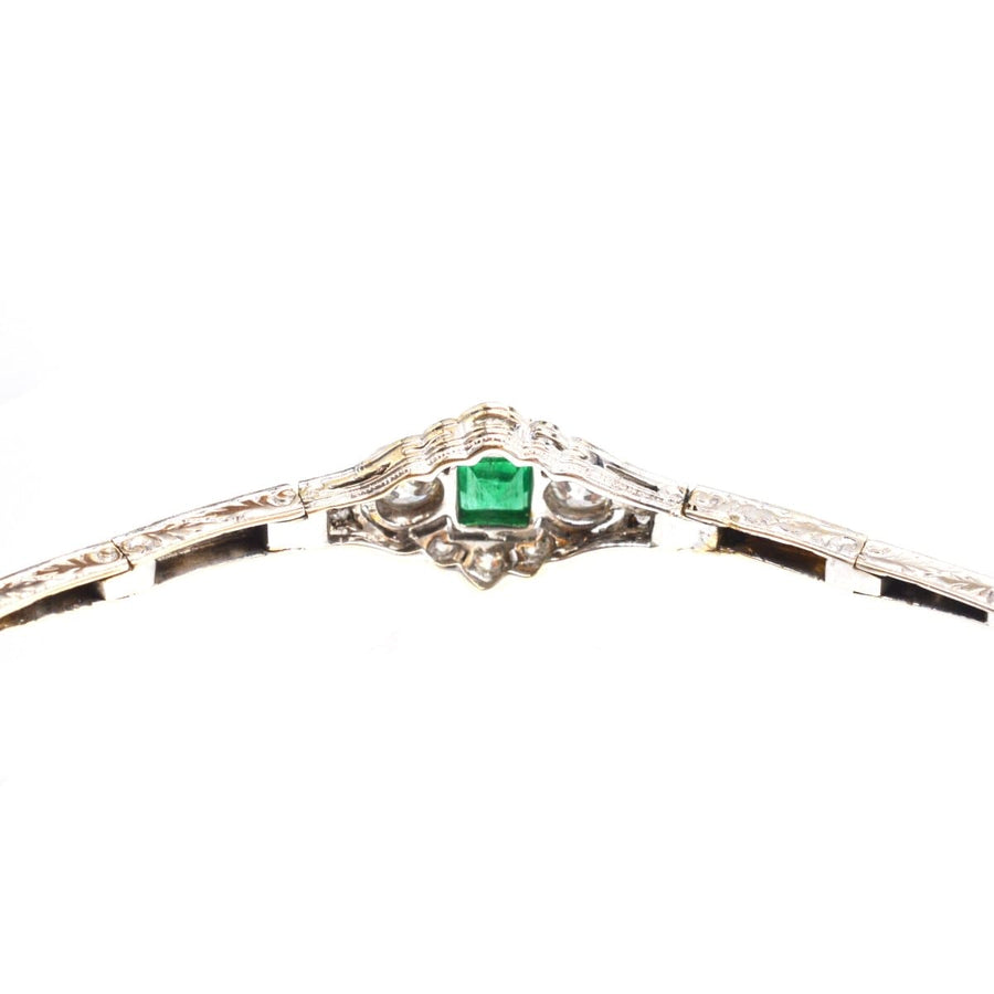 Art Deco 14ct white gold bracelet featuring a square-cut emerald and ornate design, exemplifying vintage elegance.