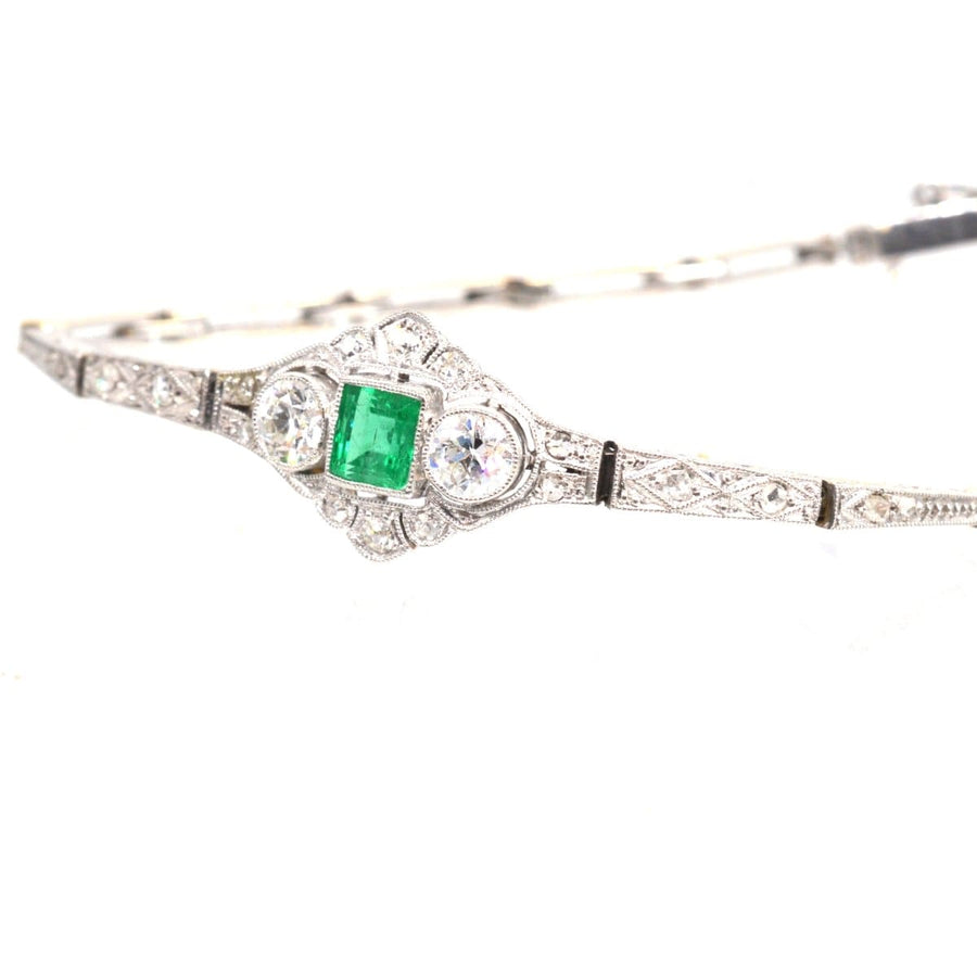 Art Deco 14ct white gold bracelet featuring a square-cut emerald and two old European cut diamonds.