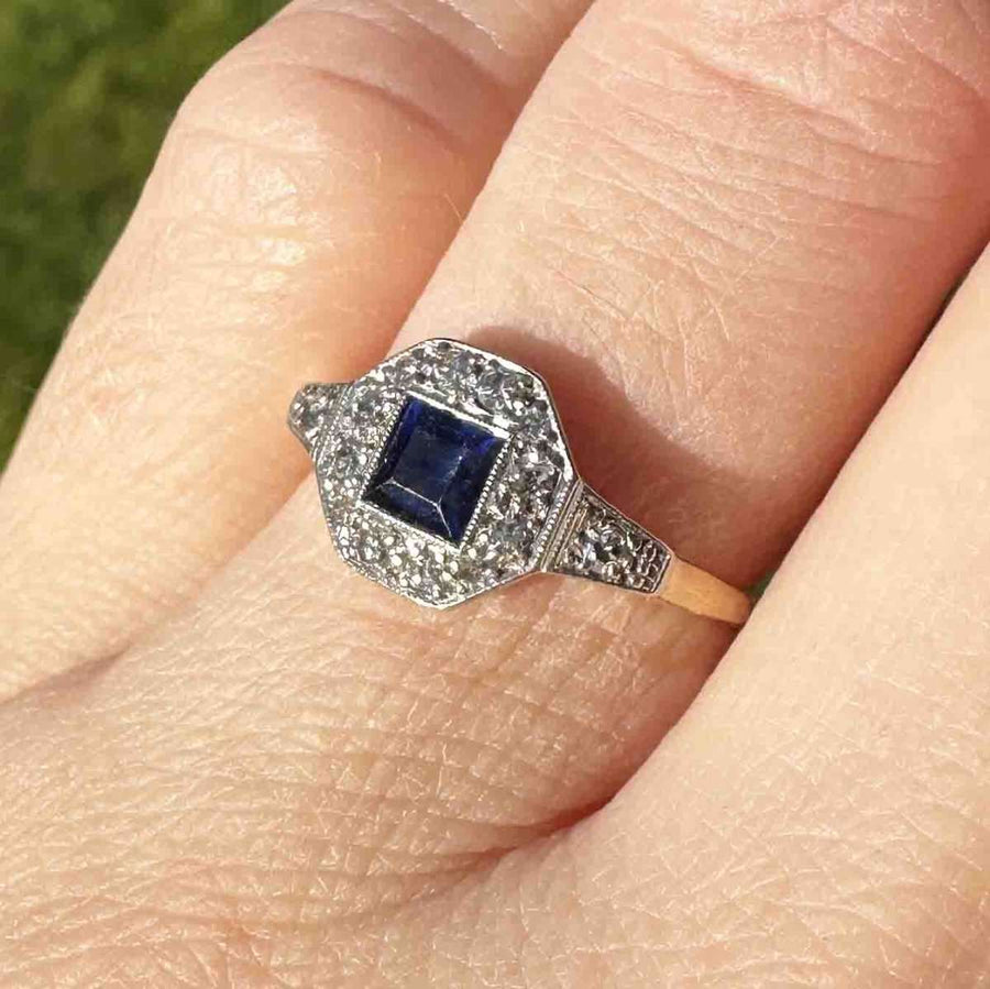 Art Deco 18ct and Platinum ring featuring a square cut sapphire and diamond detailing, perfect for engagements or September birthdays.