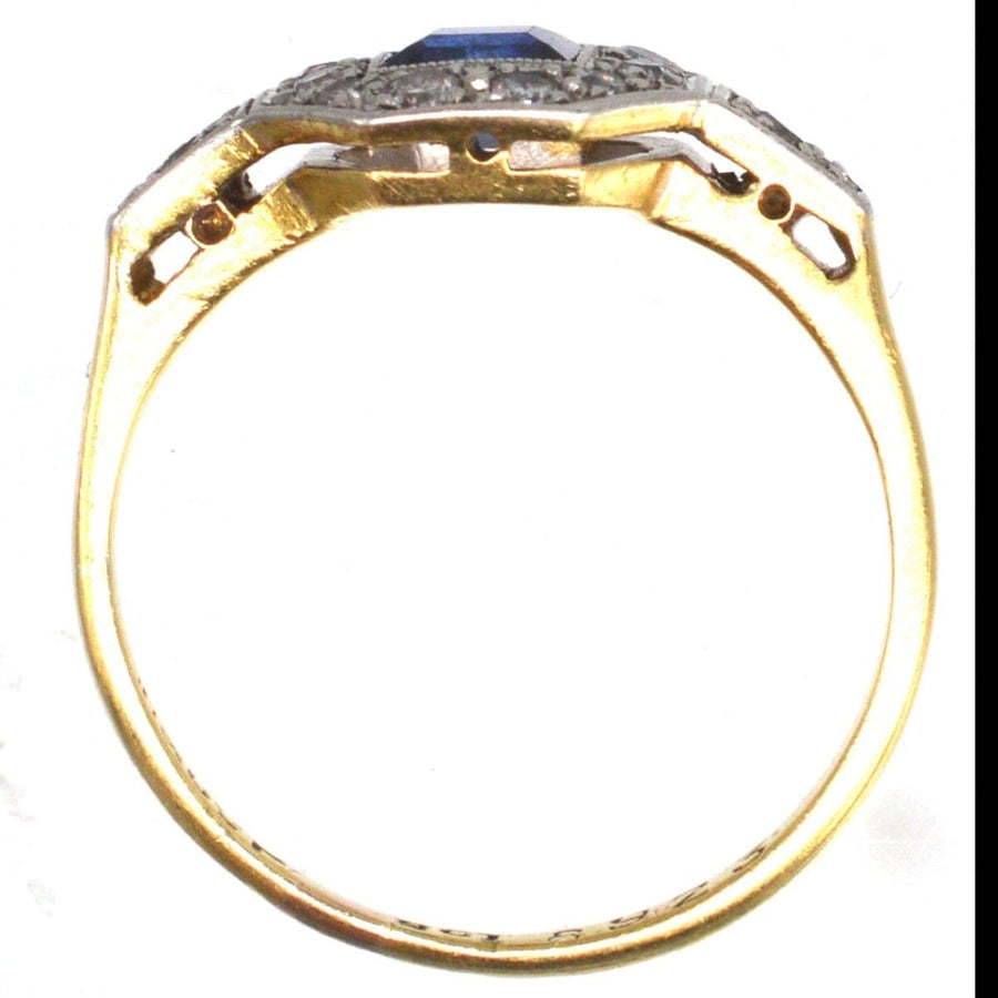 Art Deco 18ct and platinum ring featuring a square cut sapphire and diamond detailing on the shoulders.