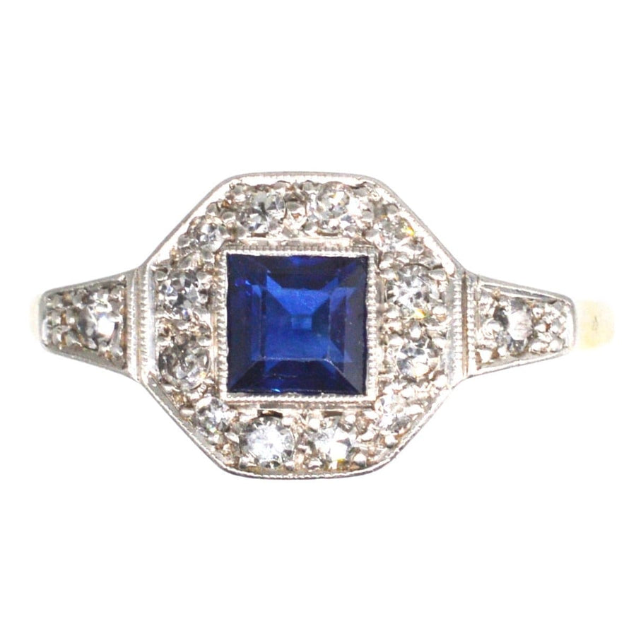 Art Deco 18ct platinum ring featuring square cut sapphire surrounded by diamonds, perfect for engagements or September birthdays.