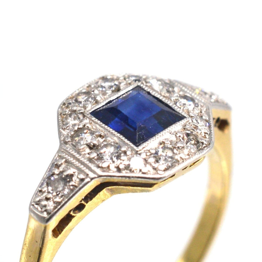 Art Deco 18ct and platinum ring featuring a square cut sapphire surrounded by diamonds, ideal for engagement or September birthdays.