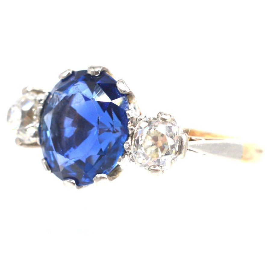Art Deco 18ct gold and platinum ring with natural Ceylon sapphire and diamond side stones.