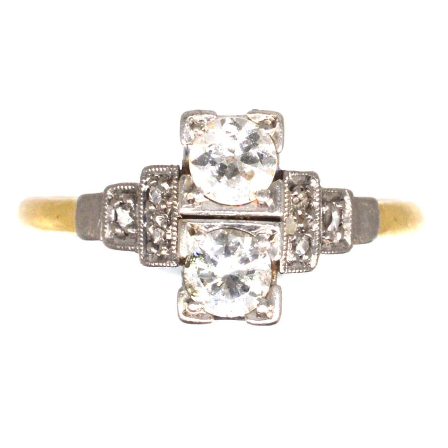 Art Deco 18ct gold and platinum two stone diamond ring with intricate shoulder detailing.