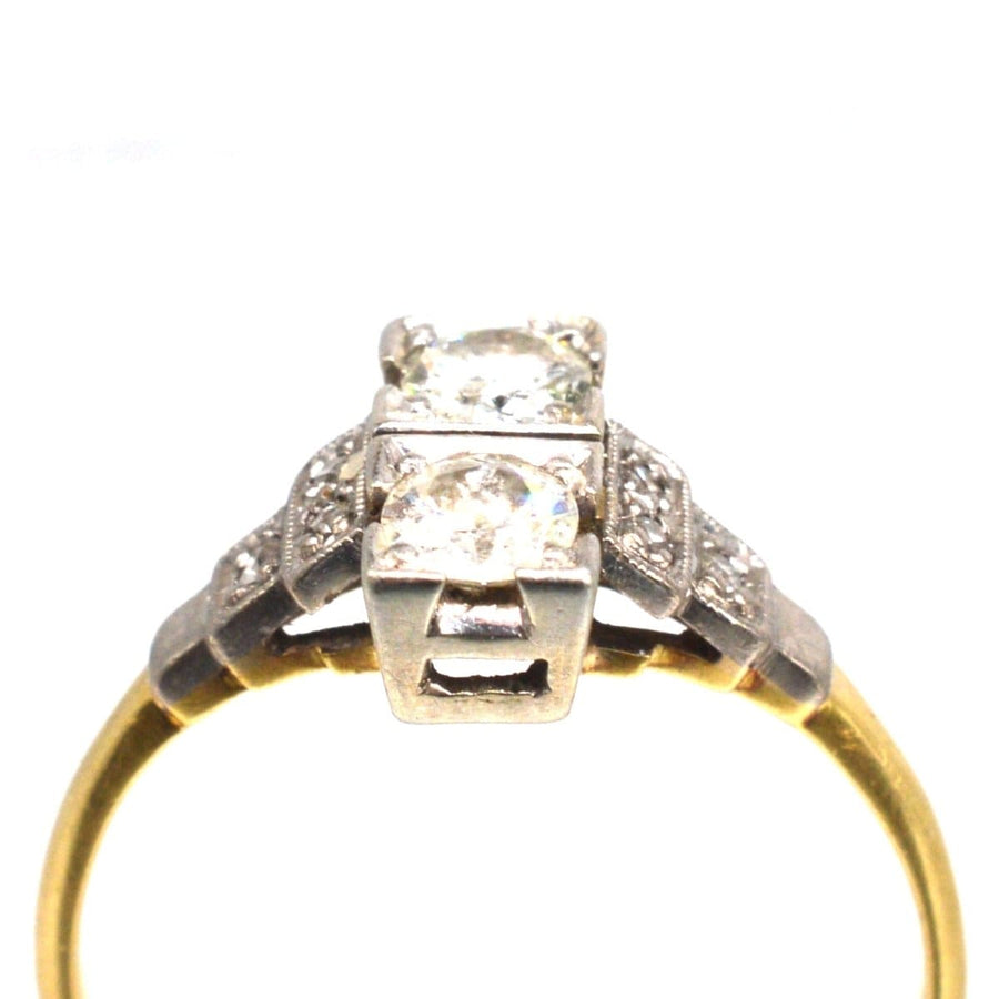 Art Deco 18ct gold and platinum two-stone diamond ring with small diamonds on shoulders.