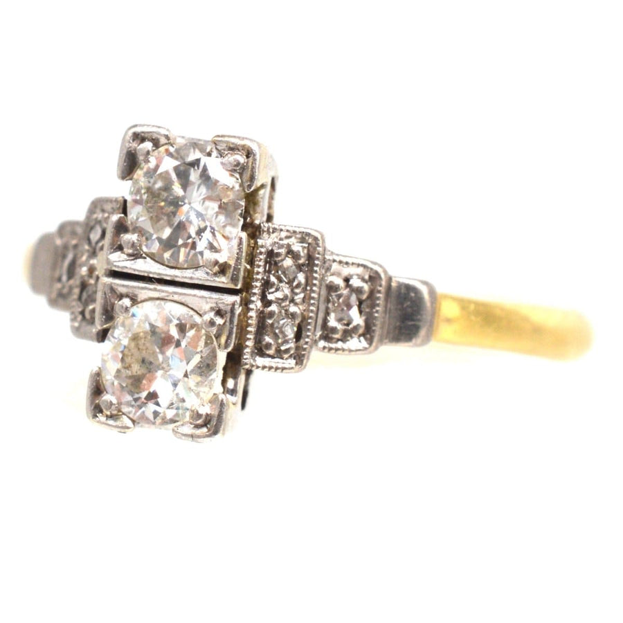 Art Deco 18ct gold and platinum two stone diamond ring with intricate design and sparkling diamonds.