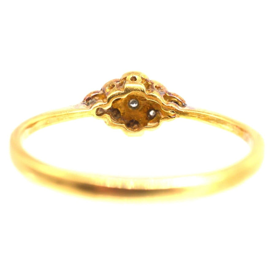 Art Deco 18ct gold diamond cluster ring featuring nine diamonds in an elegant cluster setting.